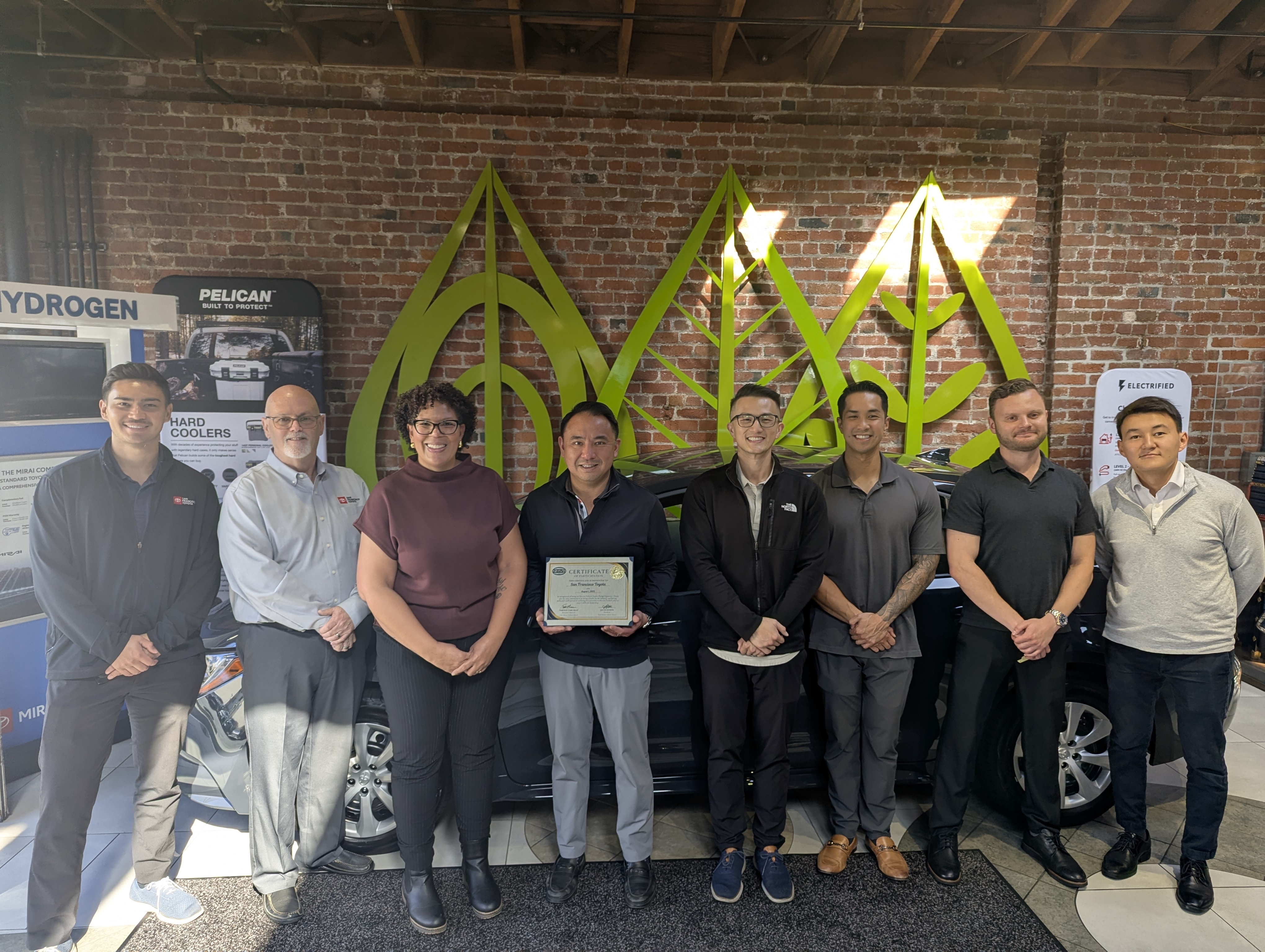 San Francisco Toyota group photo with vehicle